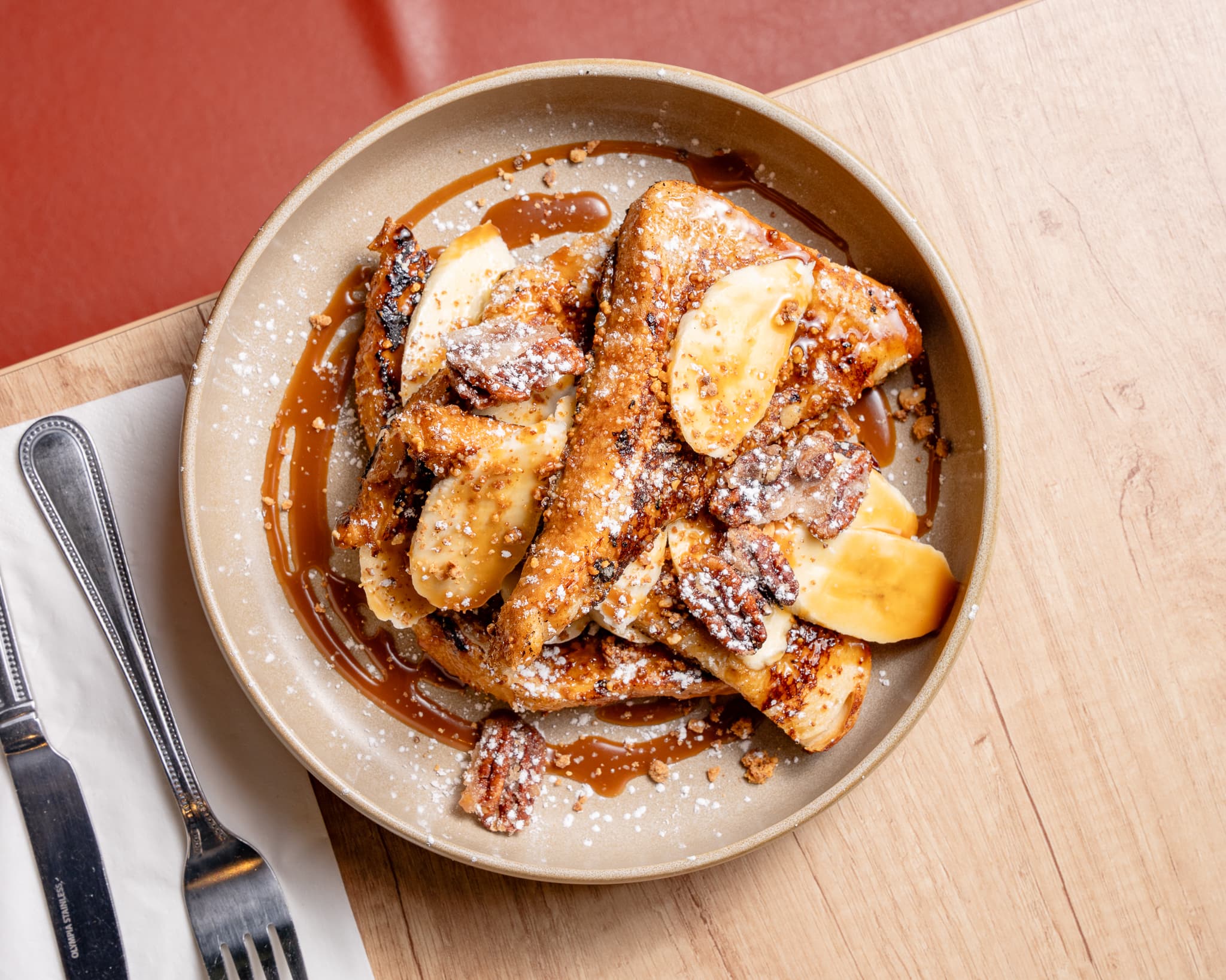 French toast with banana, pecans and caramel sauce